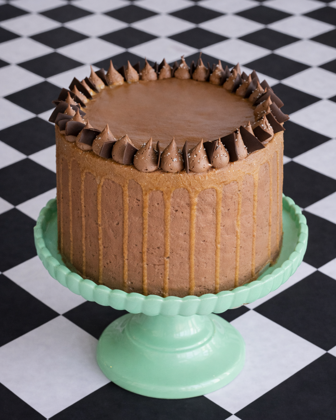 chocolate cake with chocolate fudge icing and caramel drizzle