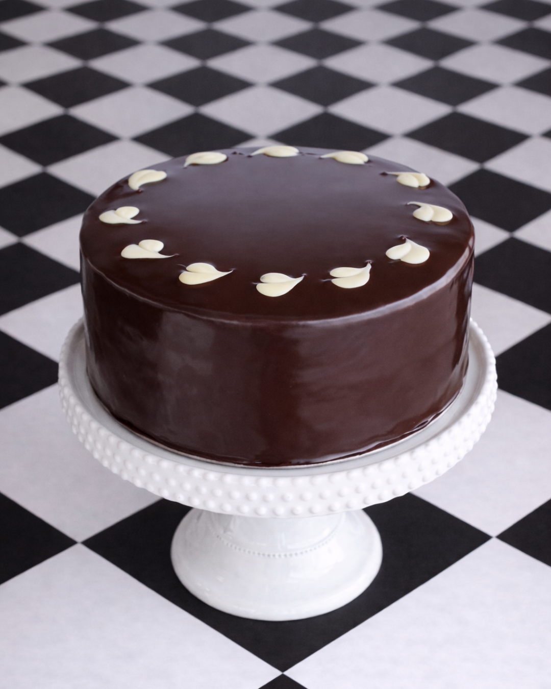 dark chocolate cake covered in chocolate ganache