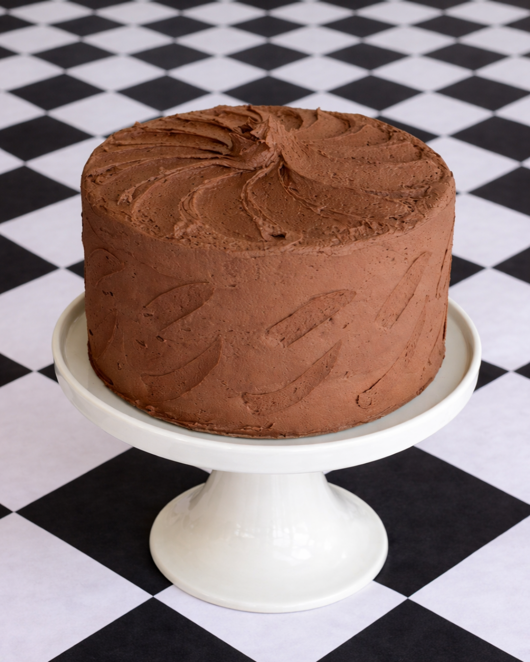 chocolate cake with chocolate fudge icing and bananas inside